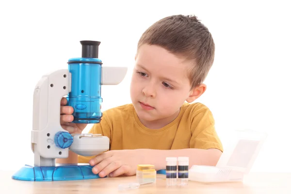 Boy with microscope — Stok fotoğraf