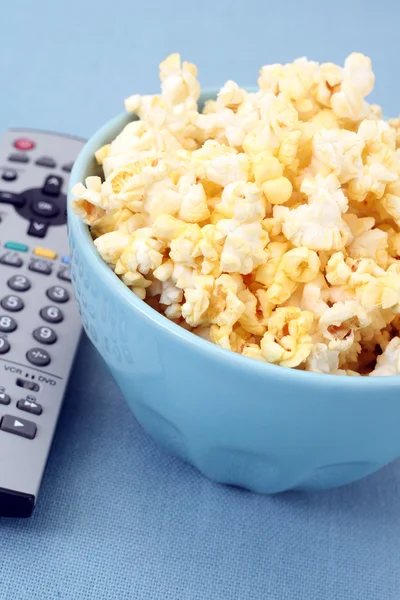 stock image Bowl of popcorn and remote control