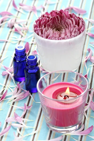 Essential oil flower and candle — Stock Photo, Image