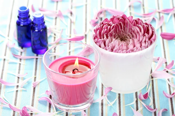 Essential oil flower and candle — Stock Photo, Image