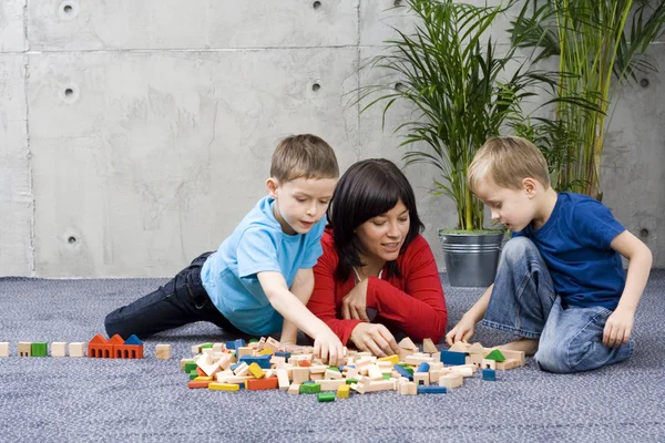 Family fun with wooden blocks — Stock Photo, Image