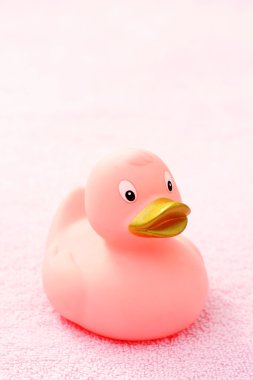 rubber duck on pink towel - body care clipart