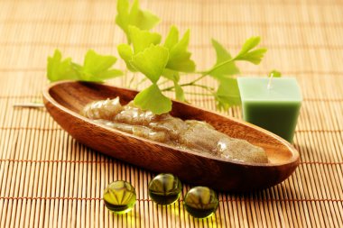 bowl of body scrub with ginko leaves - beauty treatment clipart