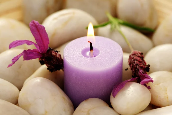 stock image candle and lavender flowers in stones - relaxing time