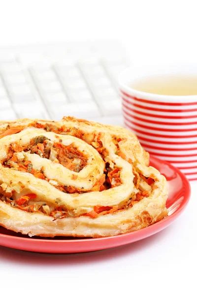 stock image quick lunch in the office - mini pizza and cup of tea