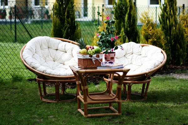 stock image perfect place to relax - picnic basket and book