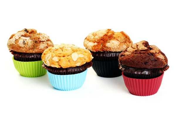Τέσσερις Muffins Απομονωθεί Λευκό Γλυκό Τροφίμων — Φωτογραφία Αρχείου
