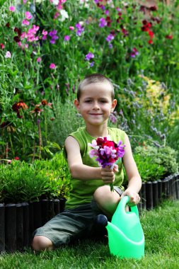 7 years old boy with watering can - kids clipart