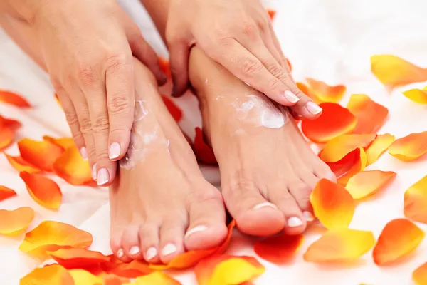 Feet care in bed — Stock Photo, Image