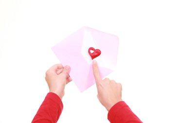 hands with love letter and heart isolated on white clipart