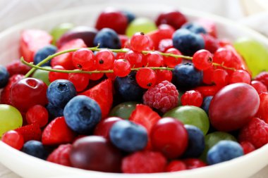 bowl of various berry fruits - fruits and vegetables clipart