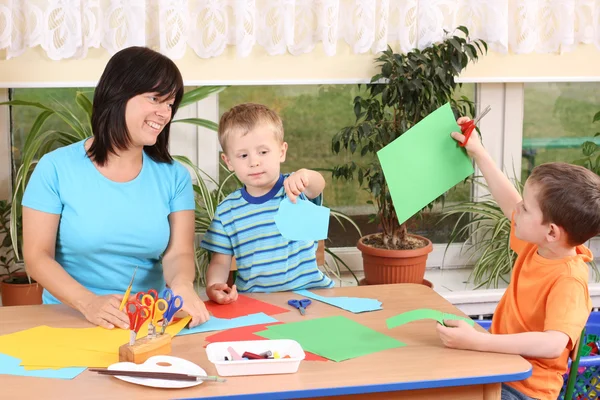 Teacher Two Preschoolers Making Some Decoration — Stock Photo, Image