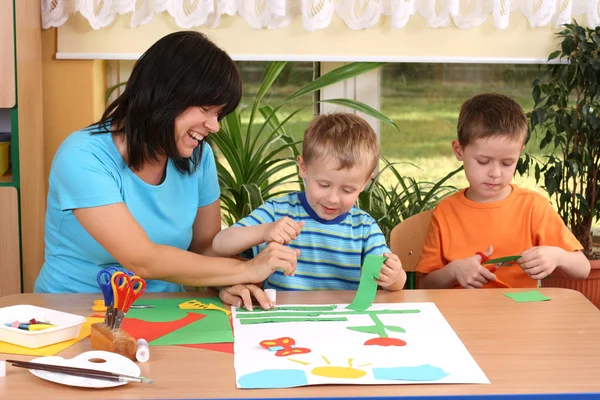 Teacher Two Preschoolers Making Some Decoration — Stock Photo, Image