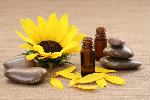 stock image stack of pebbles and bottle of aromatic oil - beauty treatment