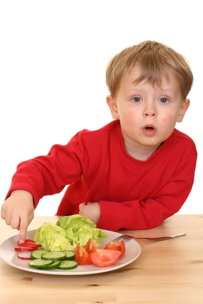 Junge und Gemüse — Stockfoto