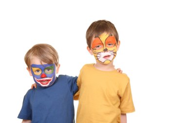 Five and three years old boys with painted faces isolated on white clipart