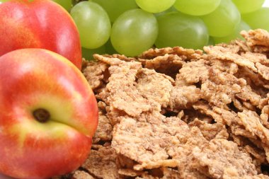 healthy snack - pile of cereals and fresh nectarines and grapes close-ups clipart