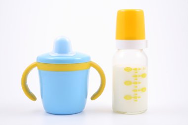 Bottle of milk and baby cup clipart
