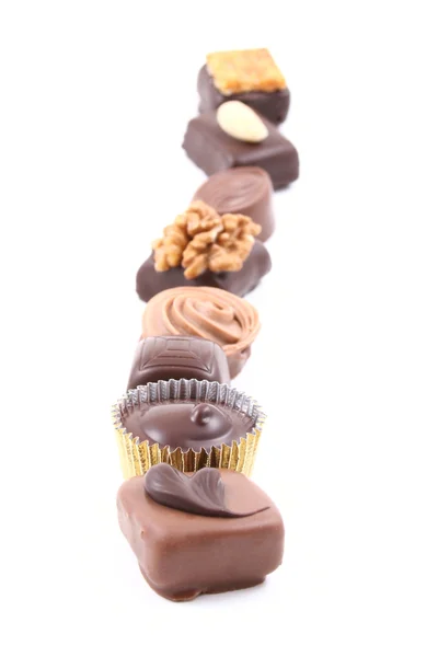 Row Mixed Chocolates Isolated White — Stock Photo, Image