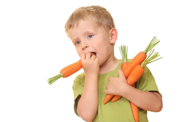 Kid en wortel — Stockfoto