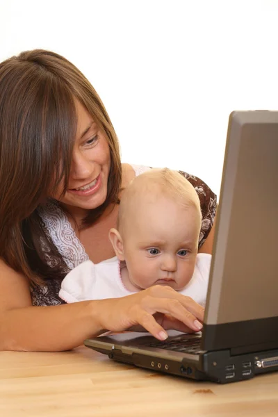 stock image mother and 8 months baby girl working together isolated on white