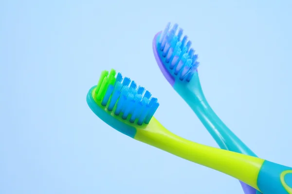 Duas Escovas Dentes Para Crianças Isoladas Azul Fotografias De Stock Royalty-Free