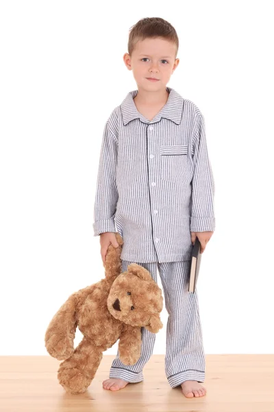 彼のテディー ベアと白で隔離される本 Pijama の少年 — ストック写真