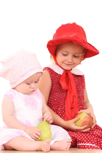 Sisters and fruits — Stock Photo, Image