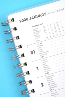 close-ups of year planner on blue background clipart