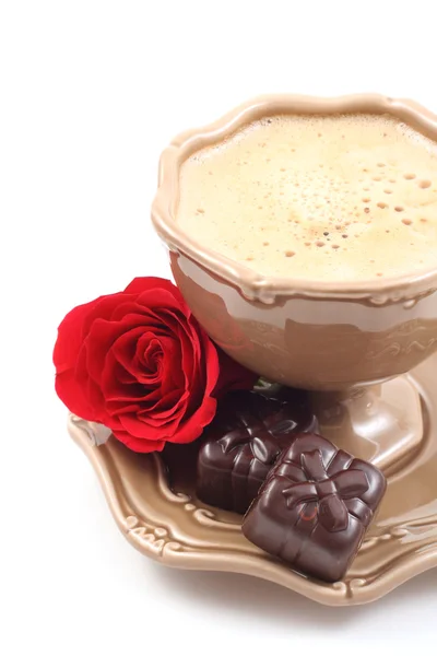 Pralines and cup of coffee — Stock Photo, Image