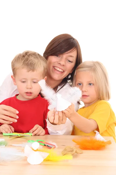 Mother Children Making Angels Paper Feather Focus Angel — Stock Fotó