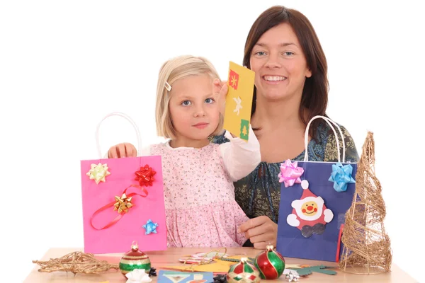 stock image mother and 5-6 years old girl making Christmas decoration /all decorations are made by mother and child/