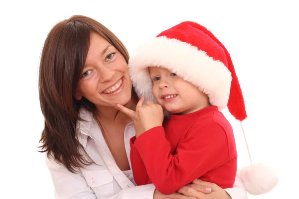 Anne Yıl Yaşlı Oğlu Noel Şapka Üzerine Beyaz Izole Eğleniyor - Stok İmaj