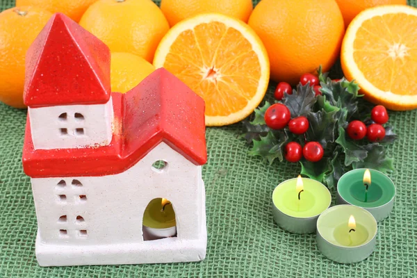 stock image some fresh oranges and candylight - winter time