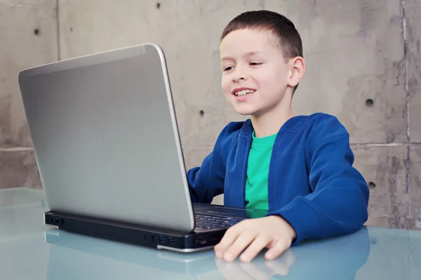 Schoolboy with laptop — Stock Photo, Image