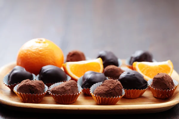 Chocolate and orange pralines — Stock Photo, Image