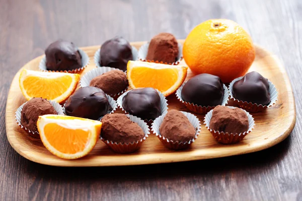 Chocolate and orange pralines — Stock Photo, Image