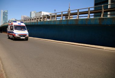 Ambulance on the street clipart