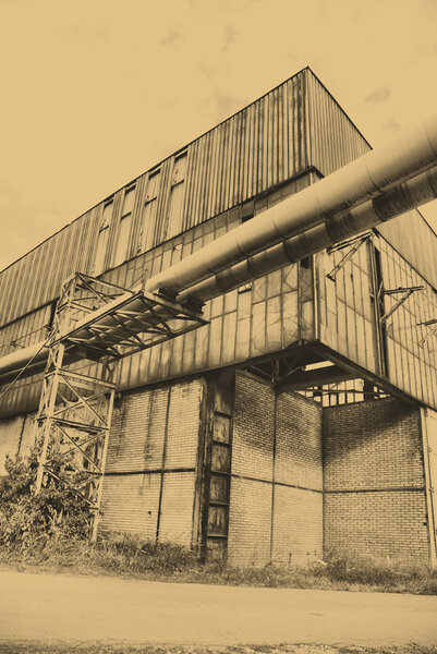 Old style photo of destroyed industrial building