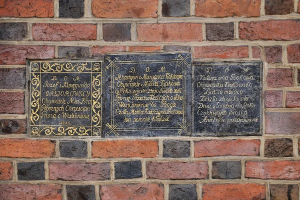 Die Gedenktafel an der Wand der Marienkirche in Krakau — Stockfoto