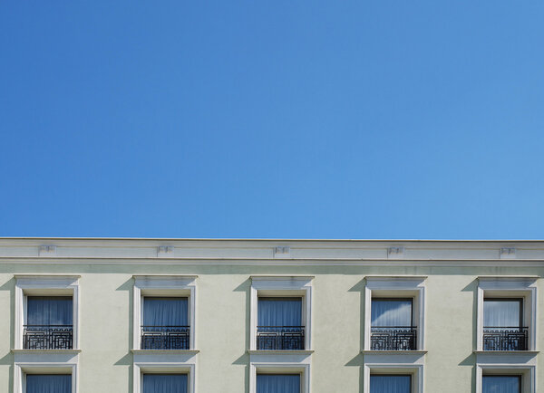 Fragment of the old building on the blue sky