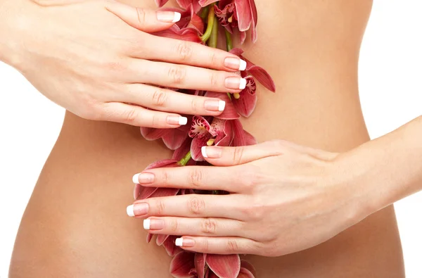 Beautiful orchid over woman body — Stock Photo, Image