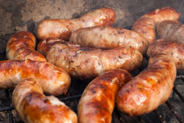 Sausages on a grill — Stock Photo, Image