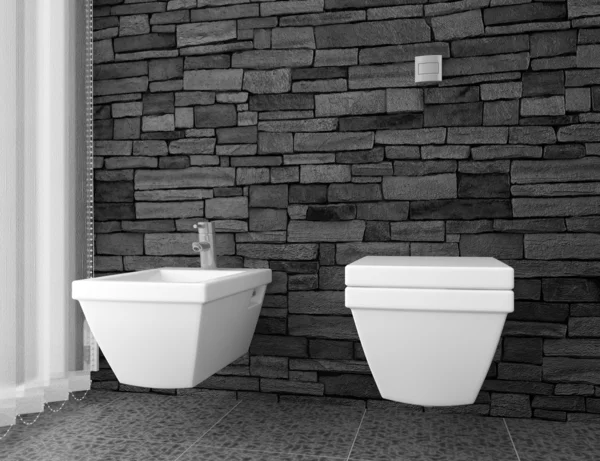Современный туалет с черной каменной стеной и белым оборудованием — стоковое фото