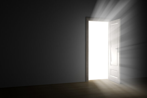 Bright light through an open door in empty room