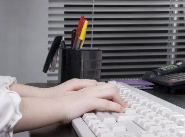 Small hands on pc keyboard clipart