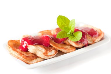 Pancakes with fresh raspbery sauce and mint clipart