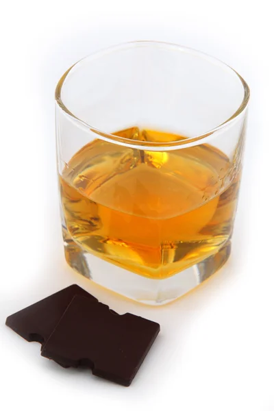 Glass of whiskey close-up on white — Stock Photo, Image
