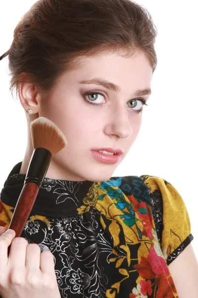 Girl with round brush for make-up — Stock Photo, Image