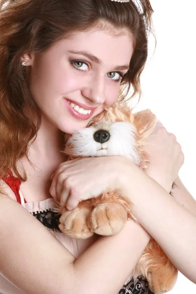 Charming girl with a soft toy — Stock Photo, Image
